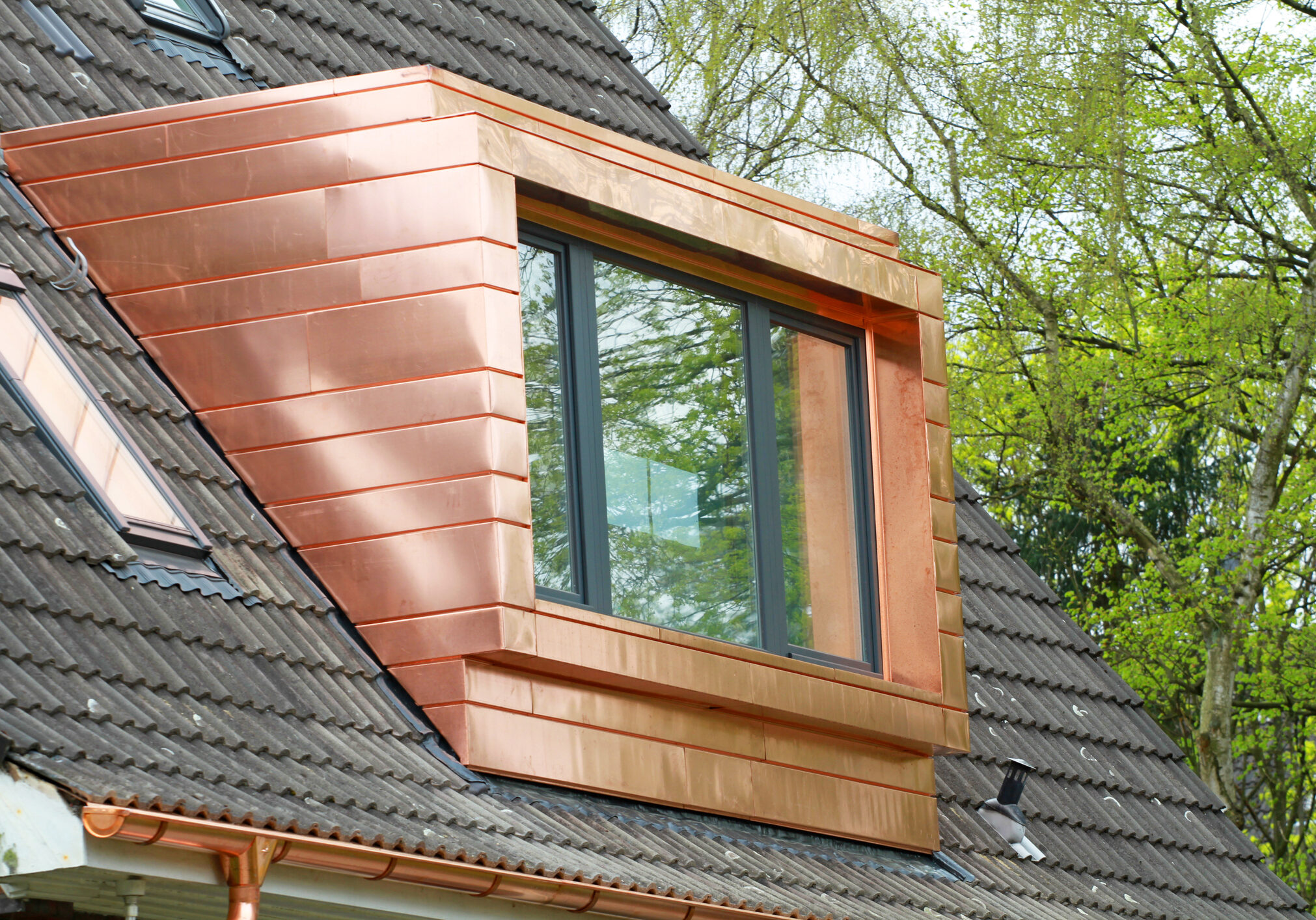 large copper dormer on rooftop